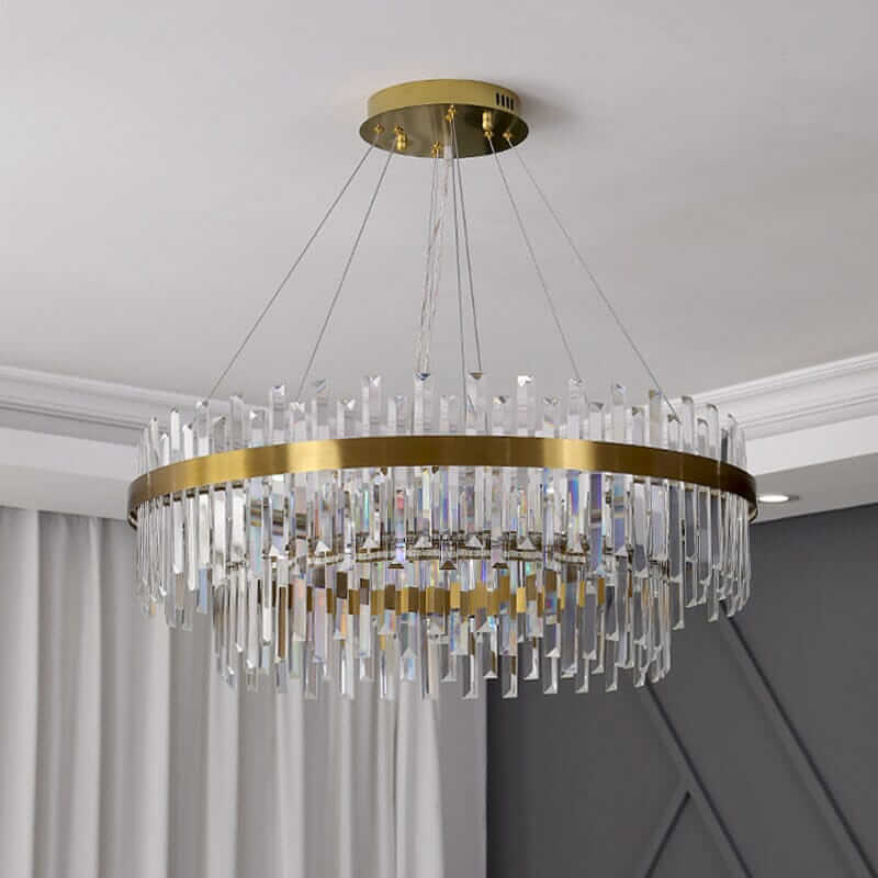 Elegant foyer chandelier with crystal accents and modern gold finish, blending traditional craftsmanship and contemporary design.