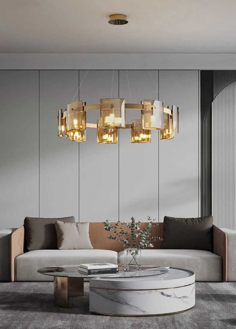 Stylish LED chandelier casting warm light over a modern living room with a cozy sofa and coffee table.