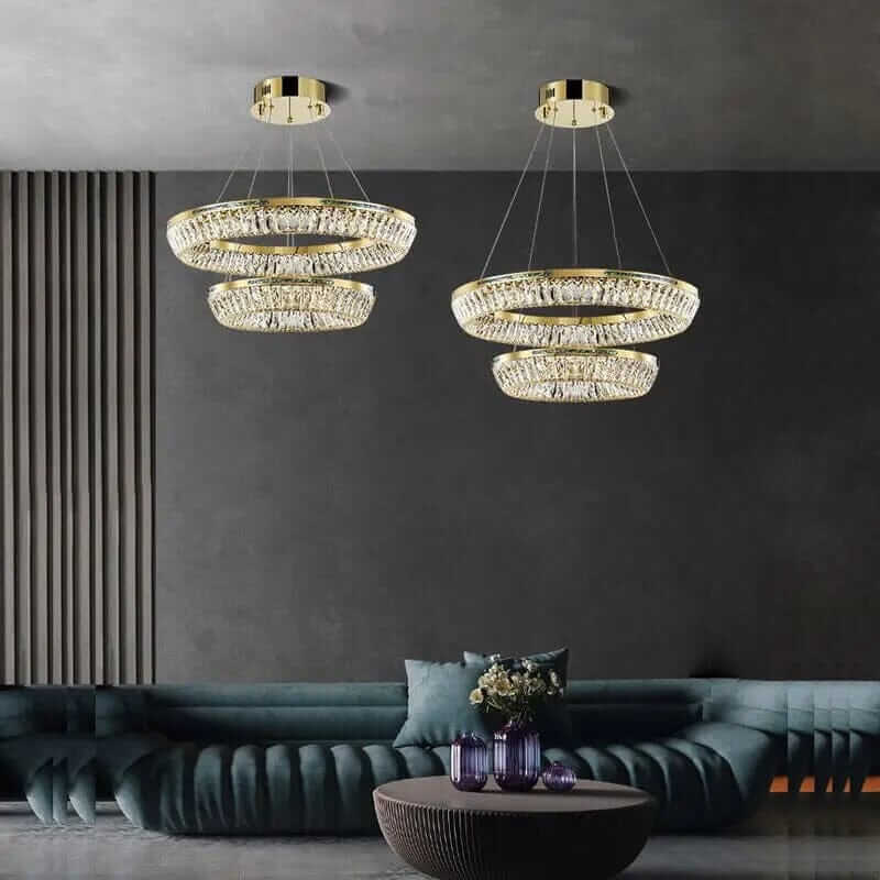 Luxurious foyer chandelier with K9 crystal accents illuminating a modern living room.