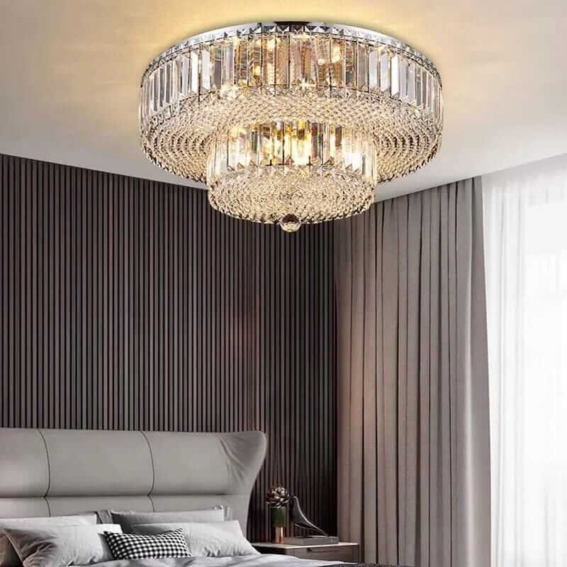 Elegant dual crystal chandelier illuminating a stylish bedroom with modern decor and soft lighting.