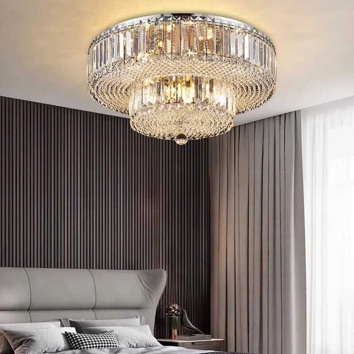 Elegant dual crystal chandelier illuminating a stylish bedroom with modern decor and soft lighting.