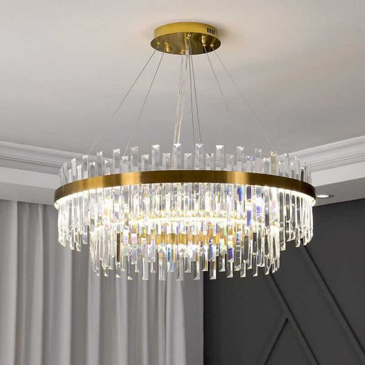 Elegant foyer chandelier featuring crystal accents and gold trim, perfect for adding sophistication to any space.