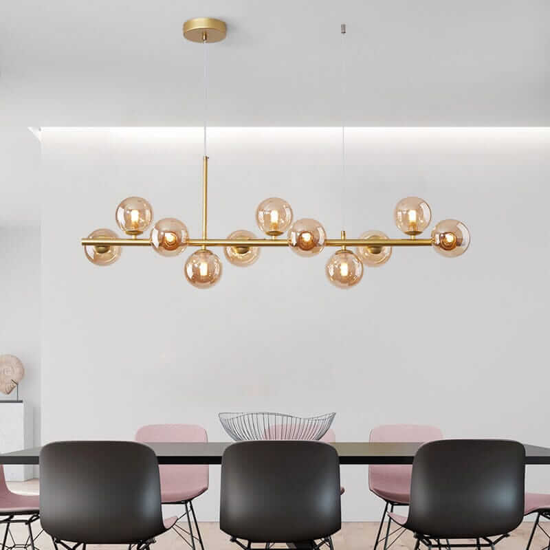 Modern Bubble Chandelier with gold accents illuminating a contemporary dining area.
