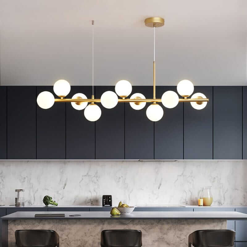 Elegant Bubble Chandelier illuminating a modern kitchen with dark cabinets and a sleek countertop.
