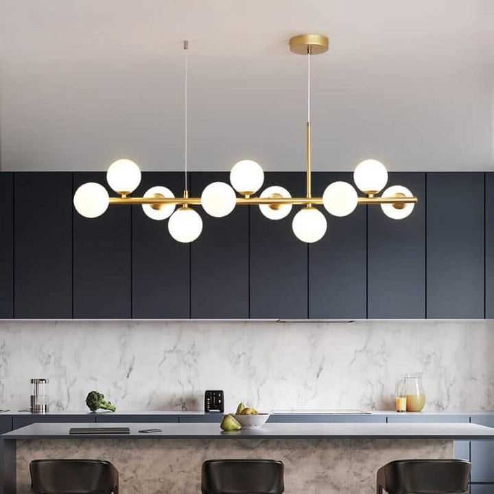 Modern Bubble Chandelier with illuminated globes, enhancing a sleek kitchen space.