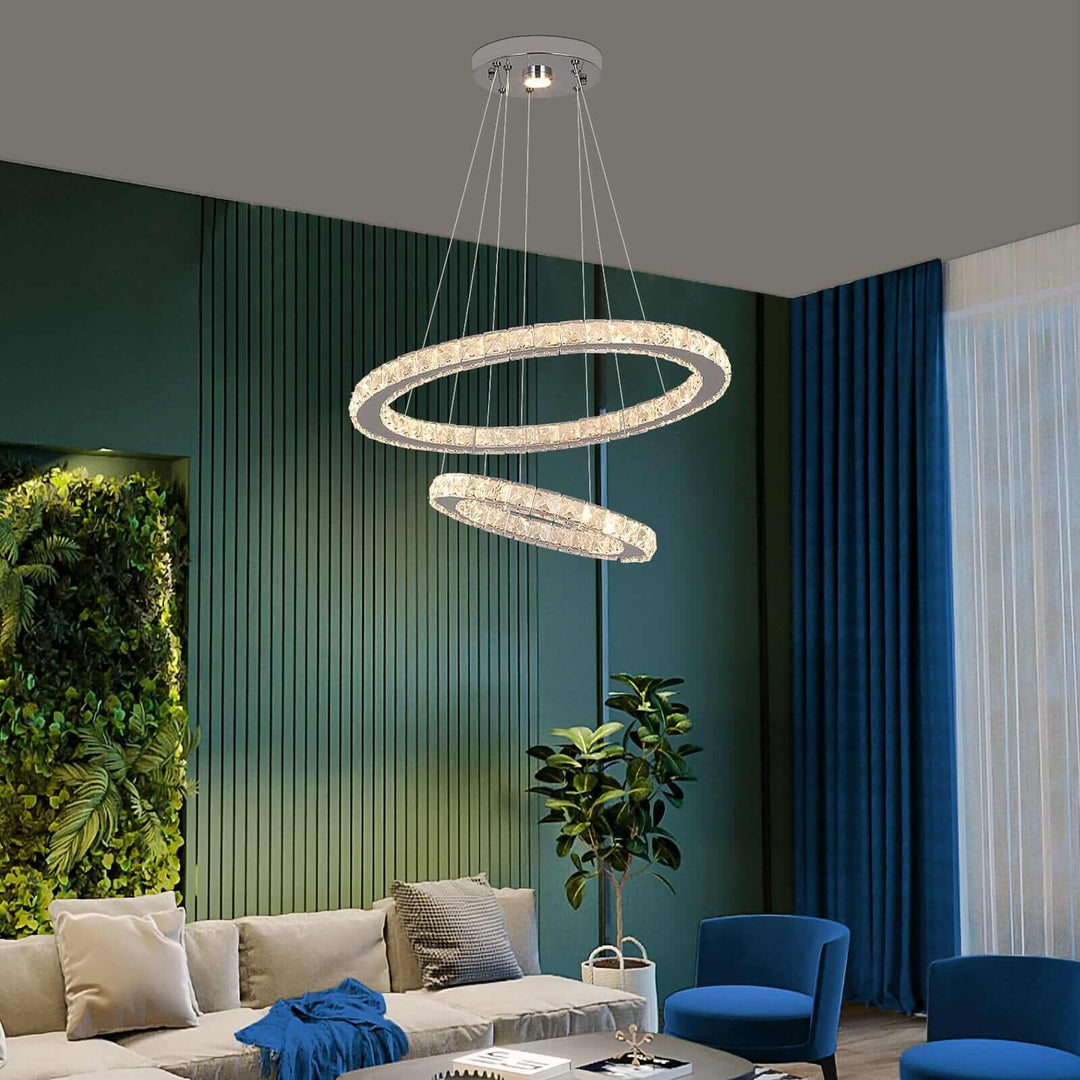 Modern foyer chandelier with dual ring design illuminating a stylish living room space.