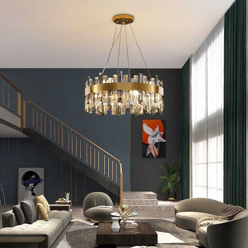 Gold crystal chandelier hanging in a stylish modern living room, adding elegance and luxury to the decor.
