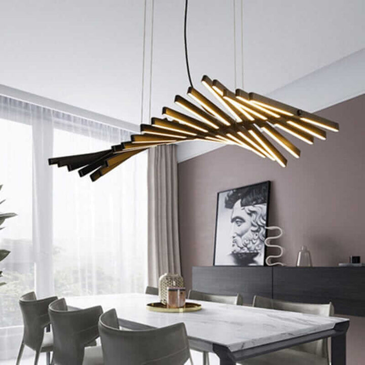 Modern black chandelier resembling a fishbone, featuring LED lights in a contemporary dining space.