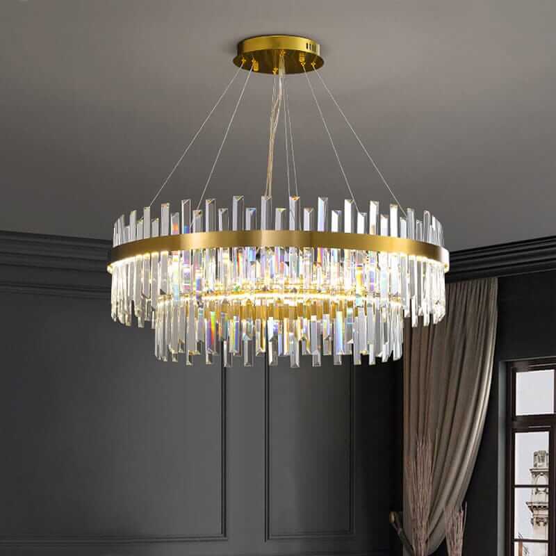 Foyer chandelier featuring gold accents and elegant crystal prisms for a modern interior ambiance.