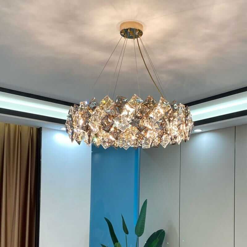 Elegant round chandelier with crystal elements reflecting light, enhancing sophistication in a modern interior.
