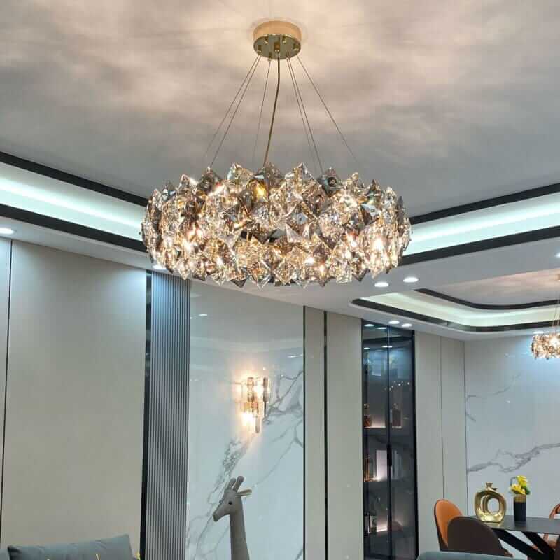 Round chandelier with crystal elements reflecting light, adding sophistication to modern decor.