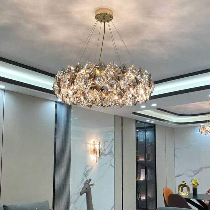 Round chandelier with crystal elements reflecting light, adding sophistication to modern decor.