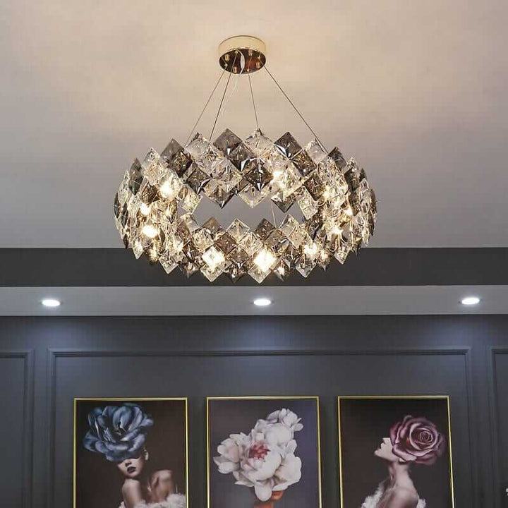 Round chandelier with crystal elements illuminating a stylish interior, showcasing sophistication and timeless beauty.
