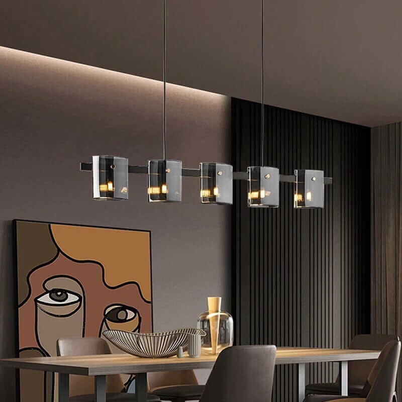 Stylish LED chandelier with glass shades illuminating a modern dining room.
