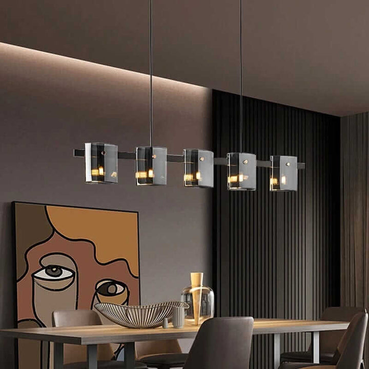 Stylish LED chandelier with glass shades illuminating a modern dining room.