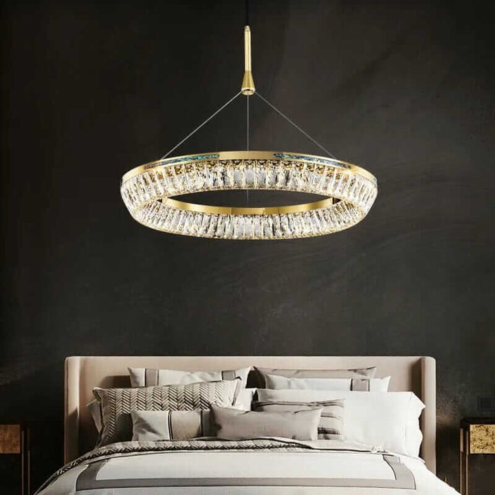 Foyer chandelier featuring K9 crystals, illuminating a modern bedroom with opulent elegance.