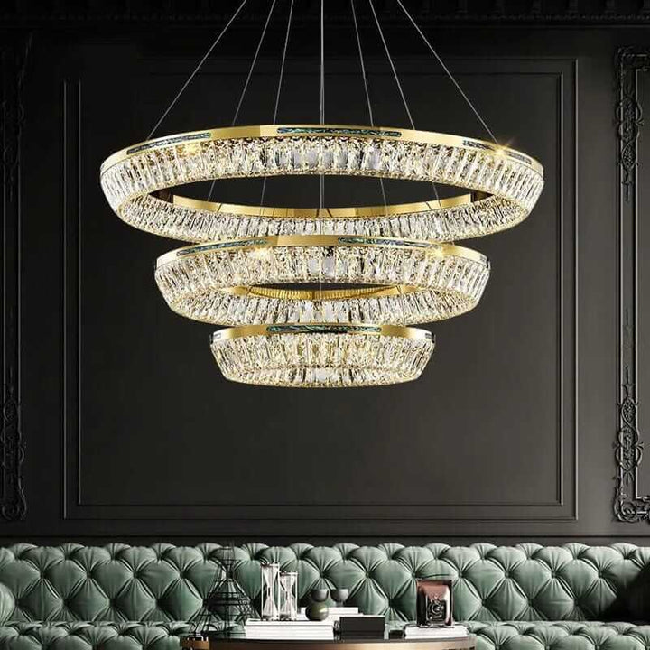 Elegant three-tier foyer chandelier with K9 crystals, enhancing opulence in a modern living space.