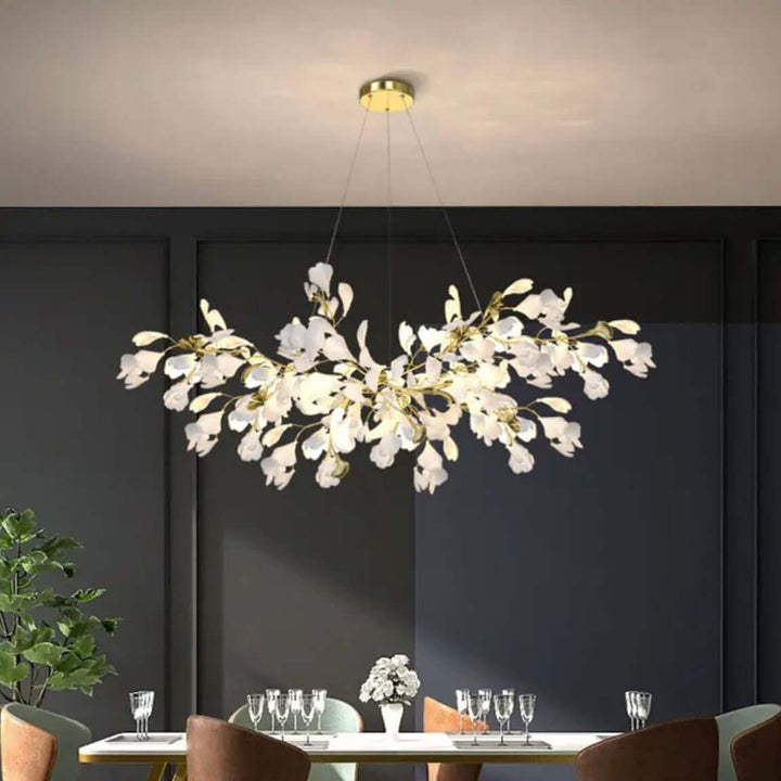 Floral chandelier with soft glowing petals, enhancing a dining room ambiance with elegance and tranquility.