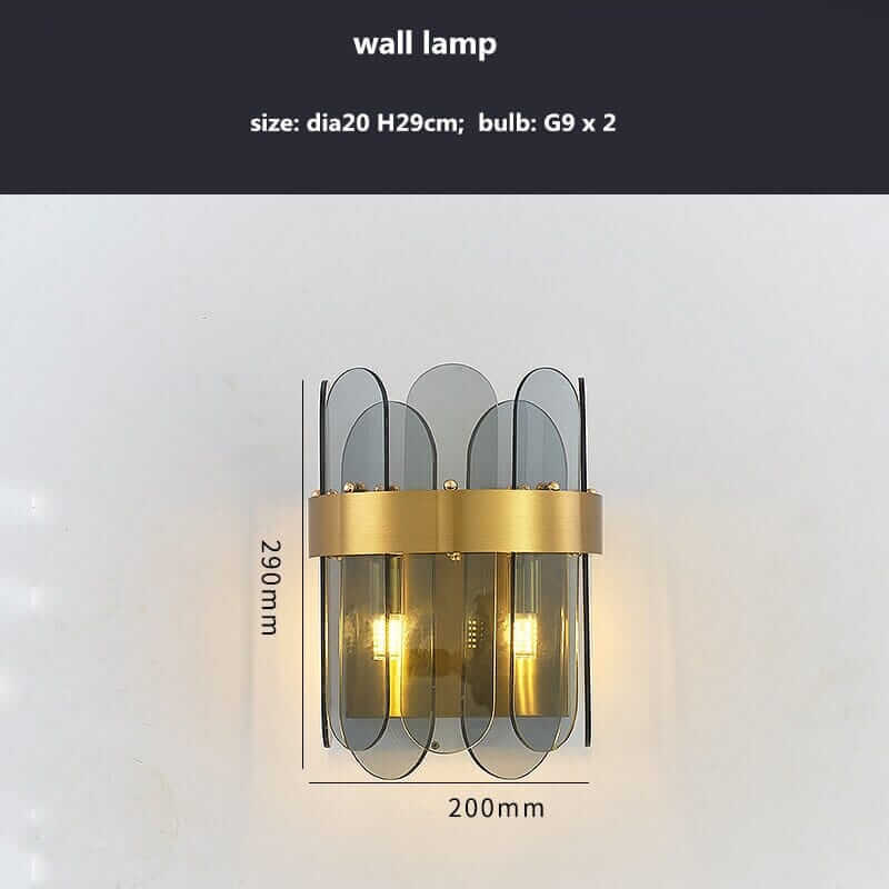 Stylish wall lamp with gold accents and transparent glass, measuring dia20cm x H29cm.