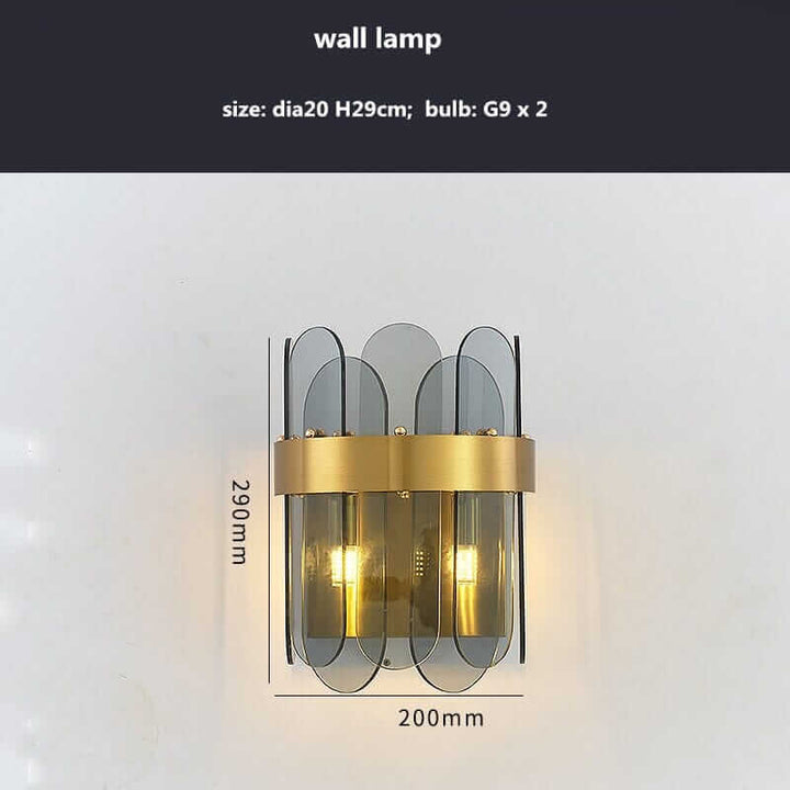 Stylish wall lamp with gold accents and transparent glass, measuring dia20cm x H29cm.