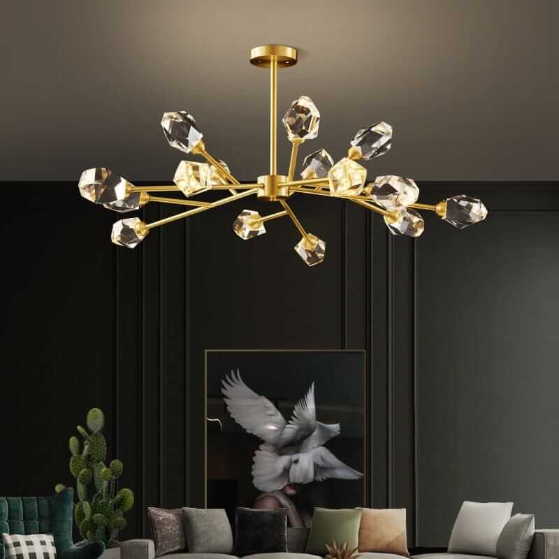Gold Sputnik chandelier with crystal accents illuminating a modern living space.