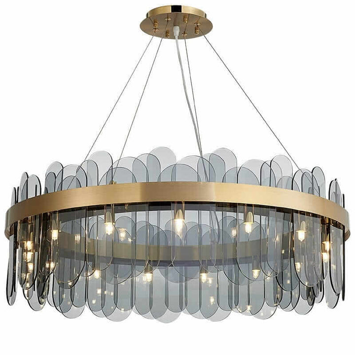 Round chandelier with crystal accents, featuring gold hardware and a modern design that enhances any space's elegance.