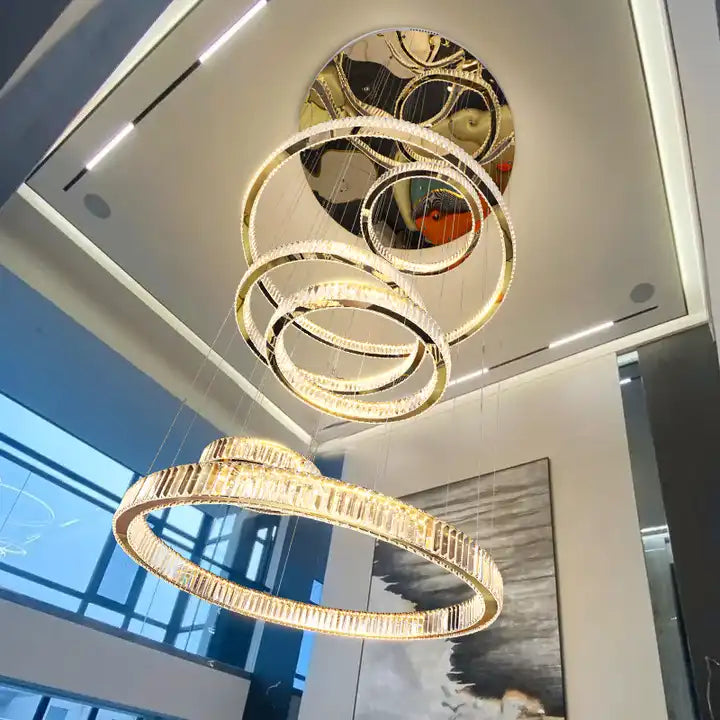 Modern circle ring LED crystal chandelier illuminating a stylish foyer with elegant design.