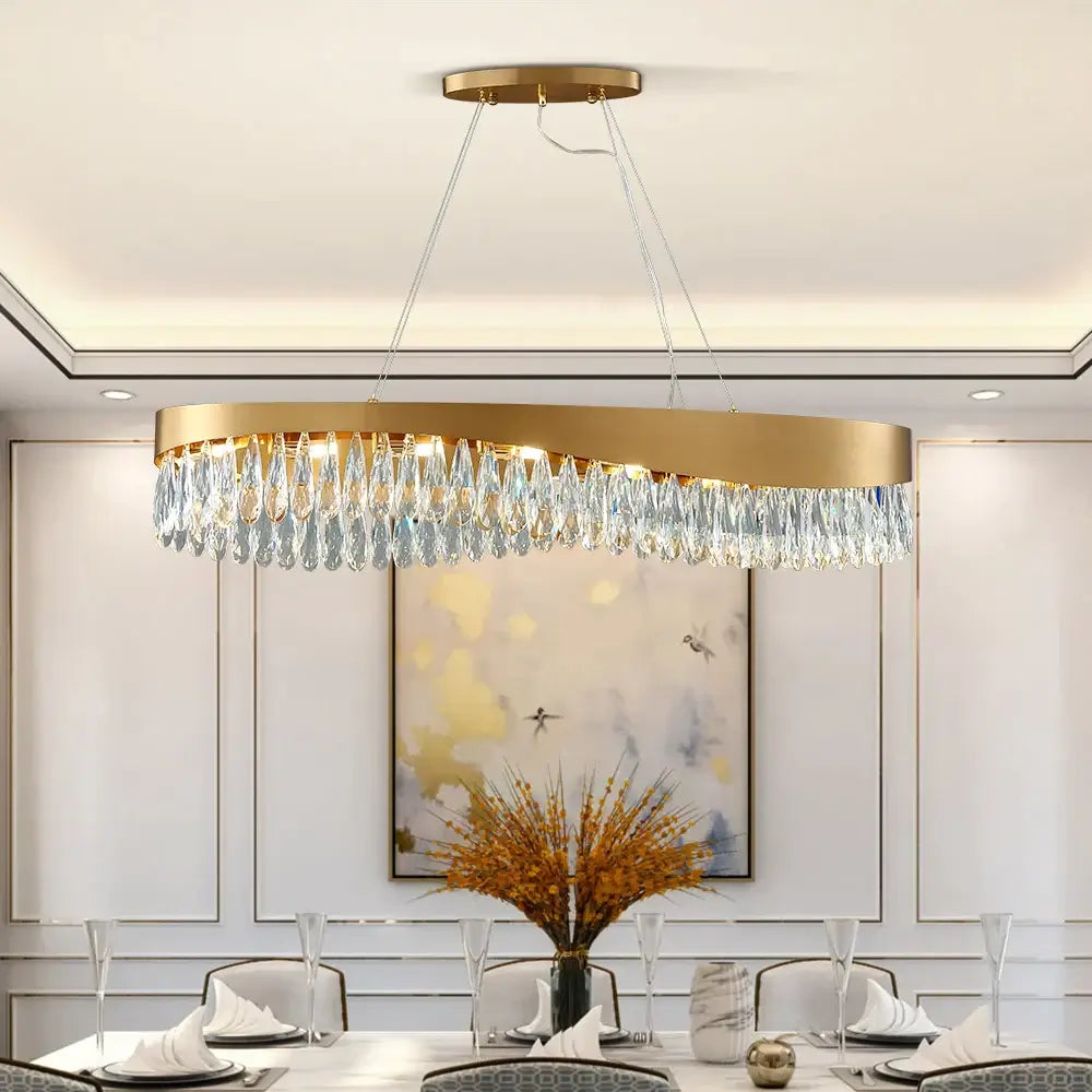 Gold oval LED crystal chandelier with adjustable height for elegant living room lighting.