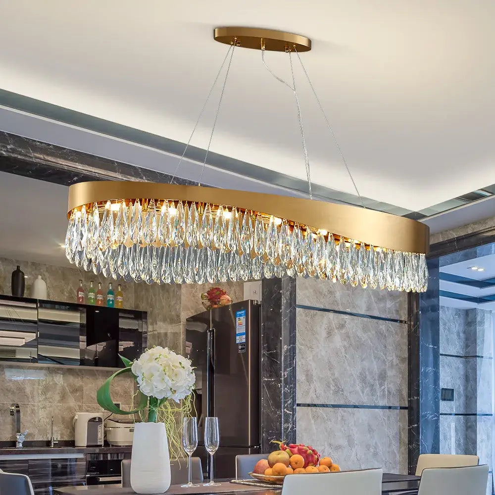 Modern oval LED crystal gold chandelier hanging in a stylish kitchen, enhancing luxury and ambiance.