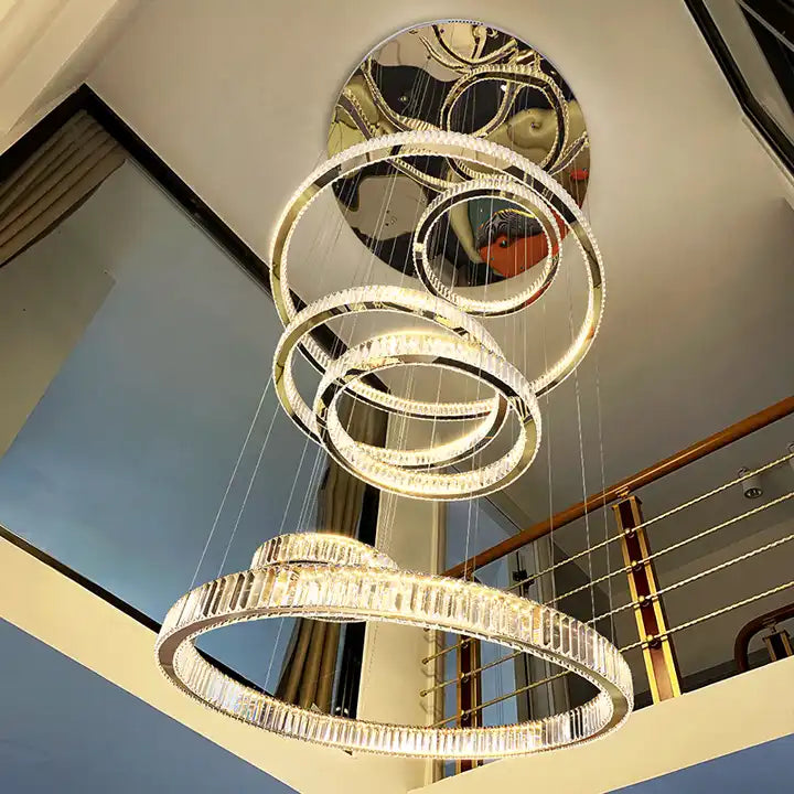 Stunning Circle Ring Long LED Crystal Chandelier hanging in a modern foyer, adding elegance and warmth to the space.