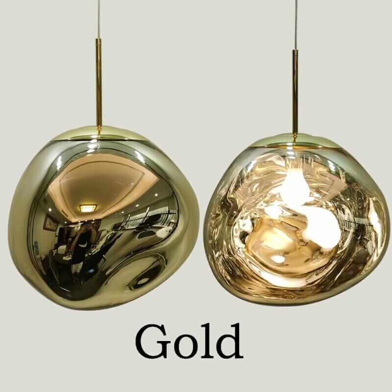 Gold dome pendant lights showcasing sleek, modern design and reflective finish for stylish home décor.