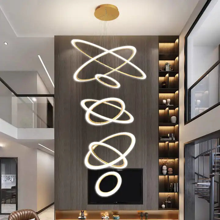 Modern 5-ring LED chandelier hanging in a stylish living room, illuminating the space with elegance.