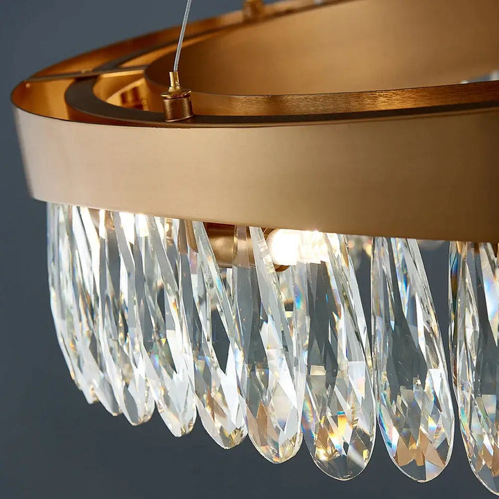 Elegant gold chandelier with crystal accents, perfect for enhancing luxury living room decor.