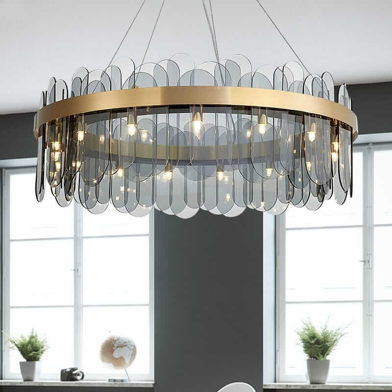 Round chandelier with crystal accents, providing elegant illumination in a modern room.
