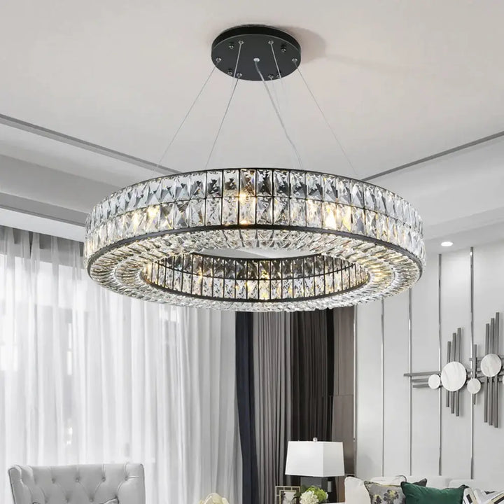 Angoona Round Modern Crystal Chandelier illuminating a contemporary living space with elegance and luxury.