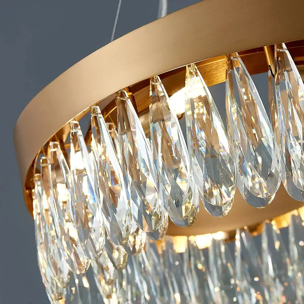 Elegant gold chandelier with crystal drops, perfect for enhancing luxury in your living room.
