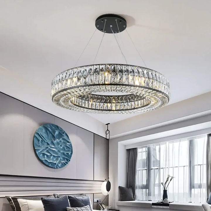 Angoona Round Modern Crystal Chandelier hanging in a stylish interior with a contemporary design.