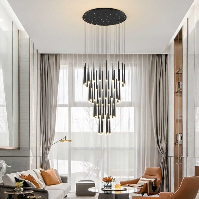 Sleek staircase chandelier with modern design hanging elegantly in a stylish living room.