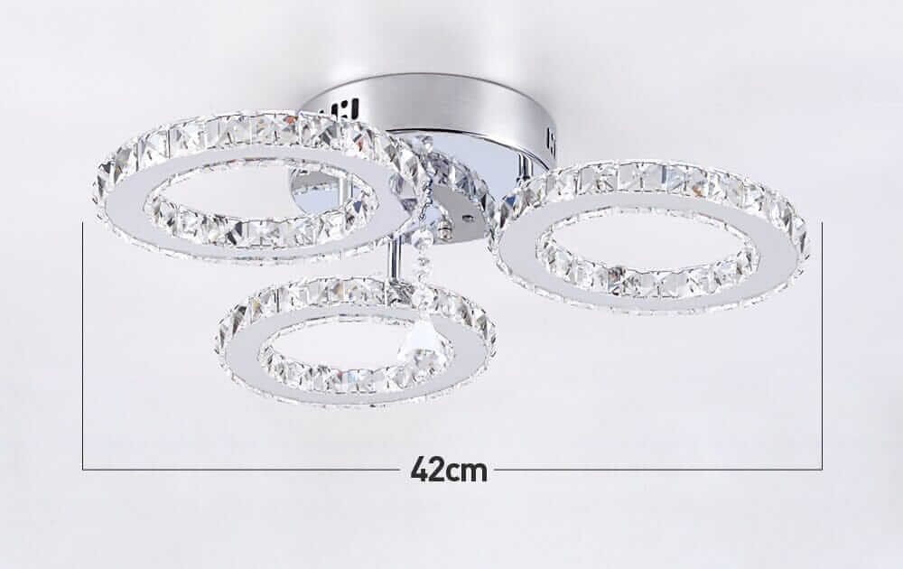 Small crystal chandelier with three circular tiers, adding elegance and glamour to any home decor, 42cm size.