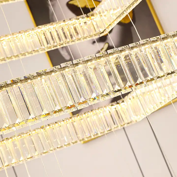 Close-up of a sleek LED chandelier showcasing crystal accents for a modern foyer or staircase.
