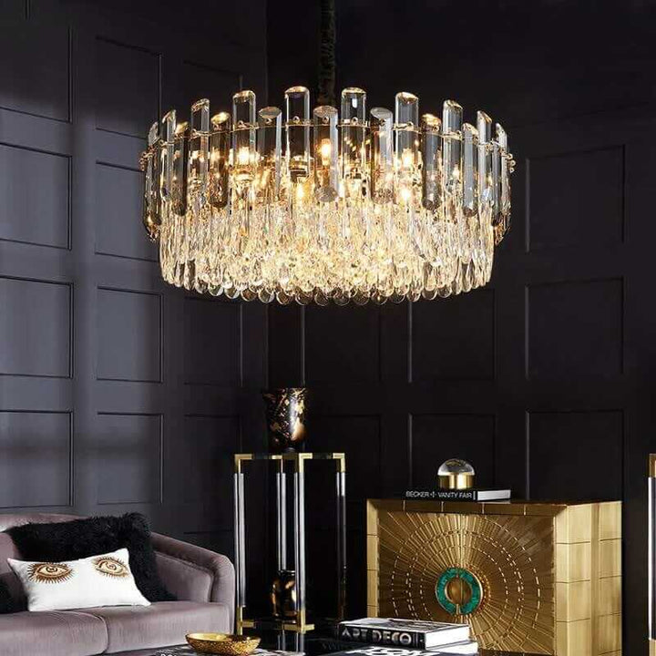 Elegant round chandelier with crystal accents illuminating a stylish living room, enhancing luxury decor.