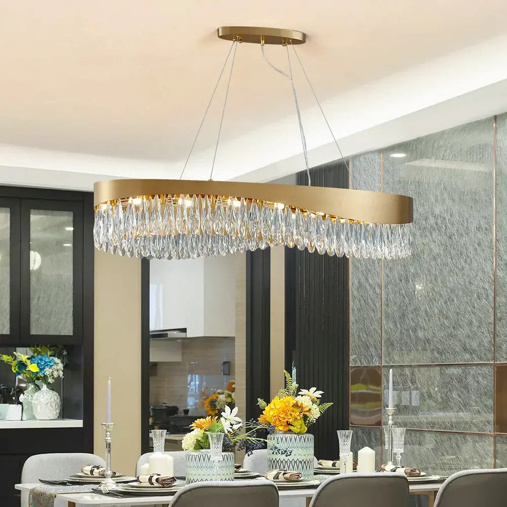 Gold LED Crystal Chandelier hanging in a modern dining room, enhancing luxury and elegance.