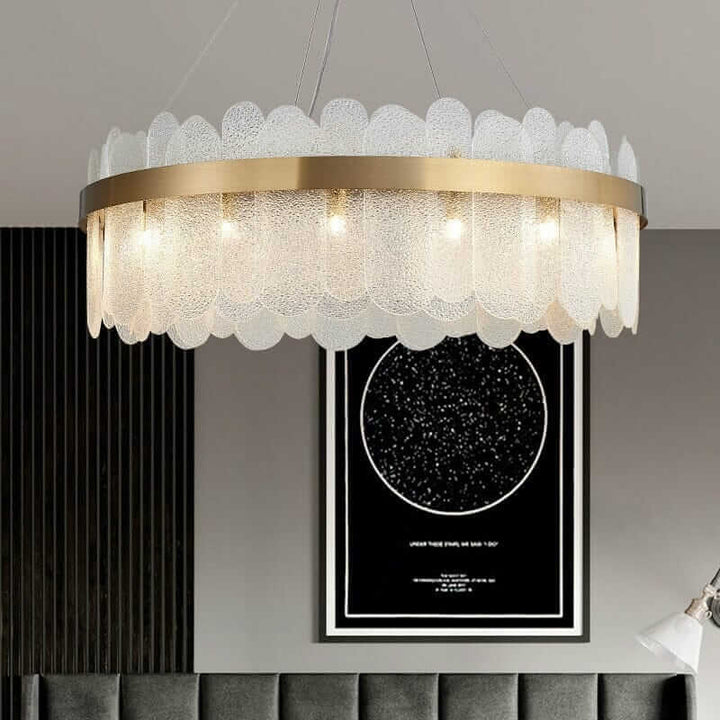 Round chandelier with crystal accents, elegant design illuminating modern living space.
