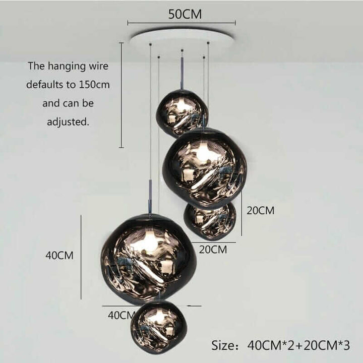 Adjustable foyer chandelier with cascading layered design, featuring five glass globes in various sizes.