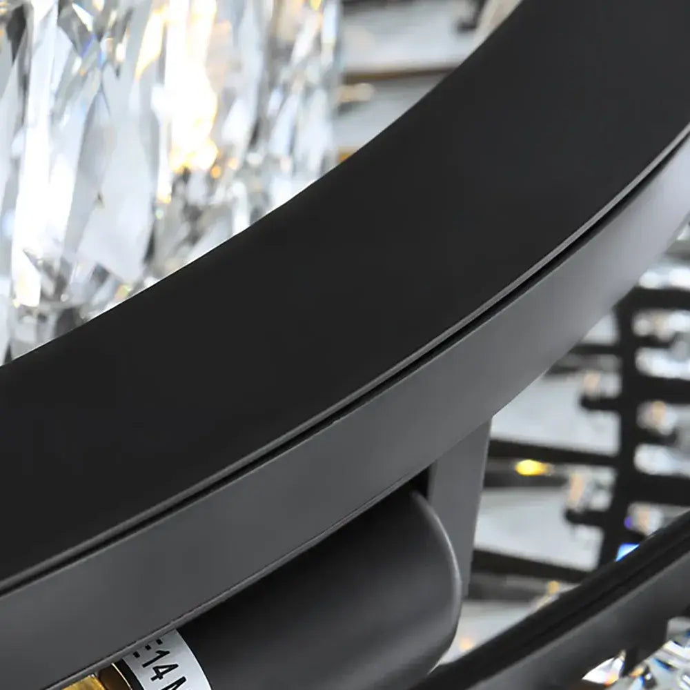Close-up of the sleek black frame of the Angoona Round Modern Crystal Chandelier, highlighting its luxury detail.