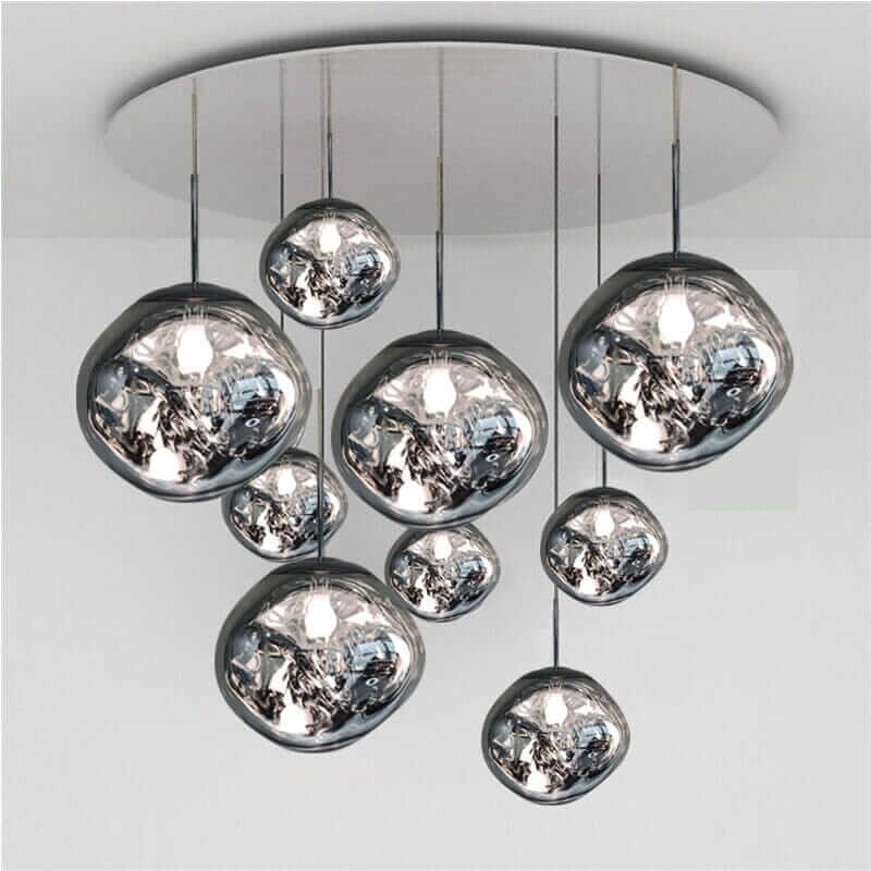Modern chandelier with hanging glass orbs, adding elegance and sophistication to any foyer or living space.
