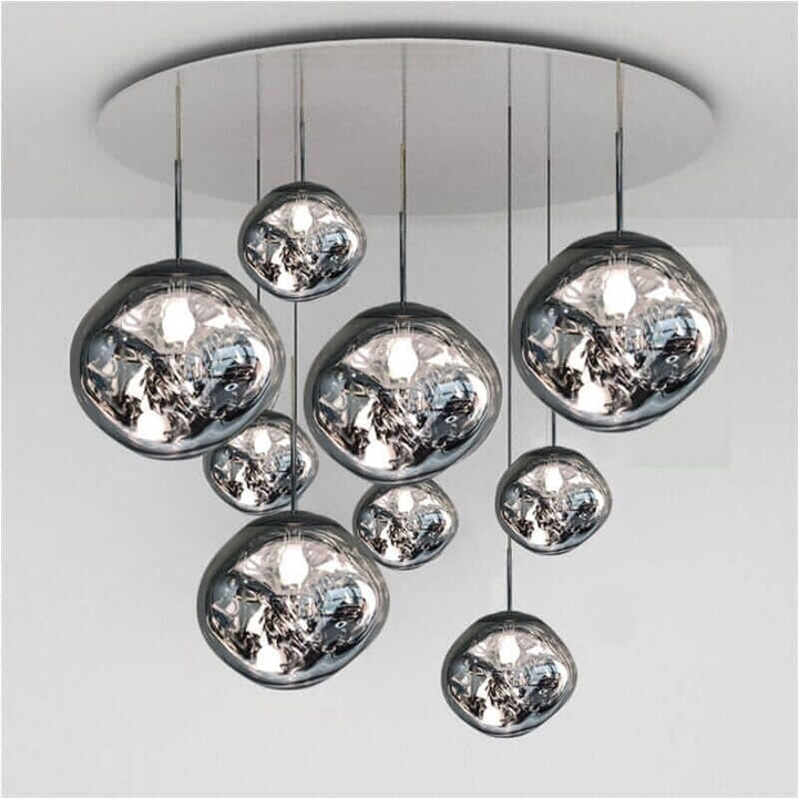 Modern chandelier with hanging glass orbs, adding elegance and sophistication to any foyer or living space.