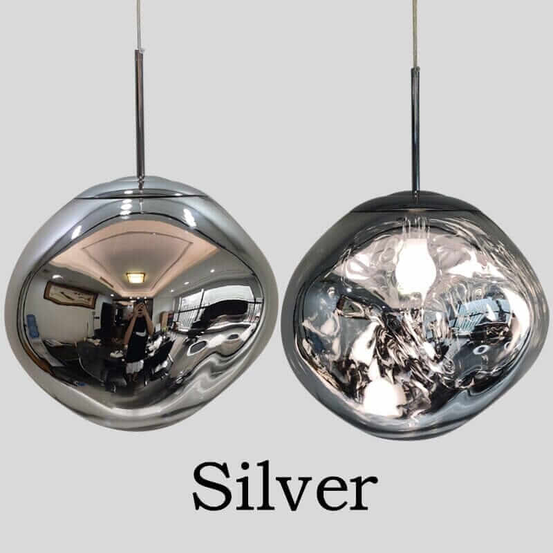 Contemporary silver pendant lights showcasing elegant, reflective design for modern interiors.
