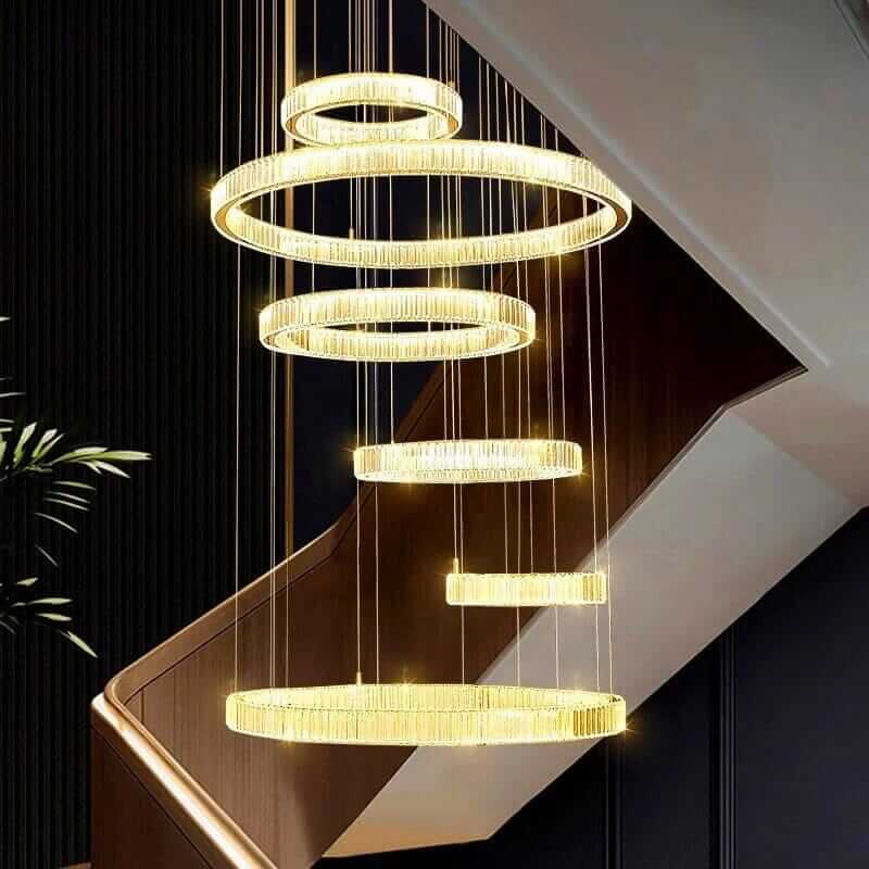 Elegant Circle Ring Long LED Crystal Chandelier illuminating a modern foyer staircase, adding sophistication to home decor.