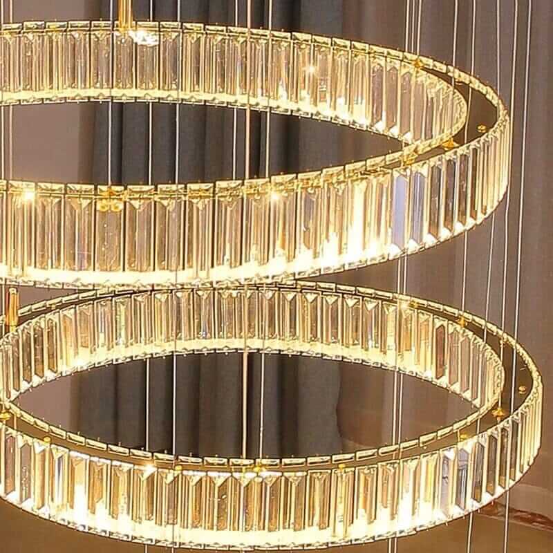 Elegant circle ring LED crystal chandelier illuminating a stylish interior space.